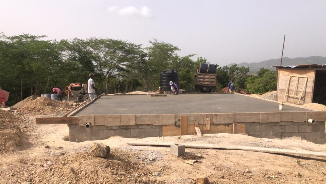 Reinforced-concrete top of the 35,000-gallon Hills of His Grace cistern designed to support a school classroom