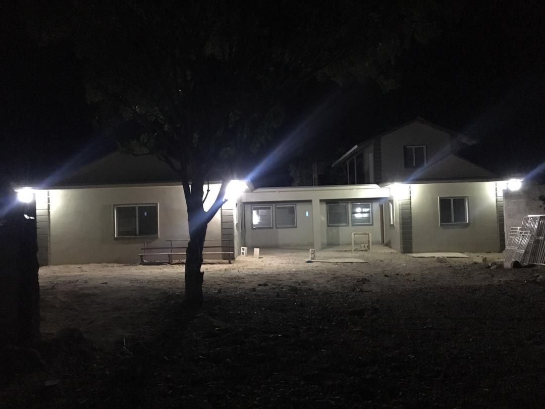 Completed HTGO Mission House illuminated in the evening