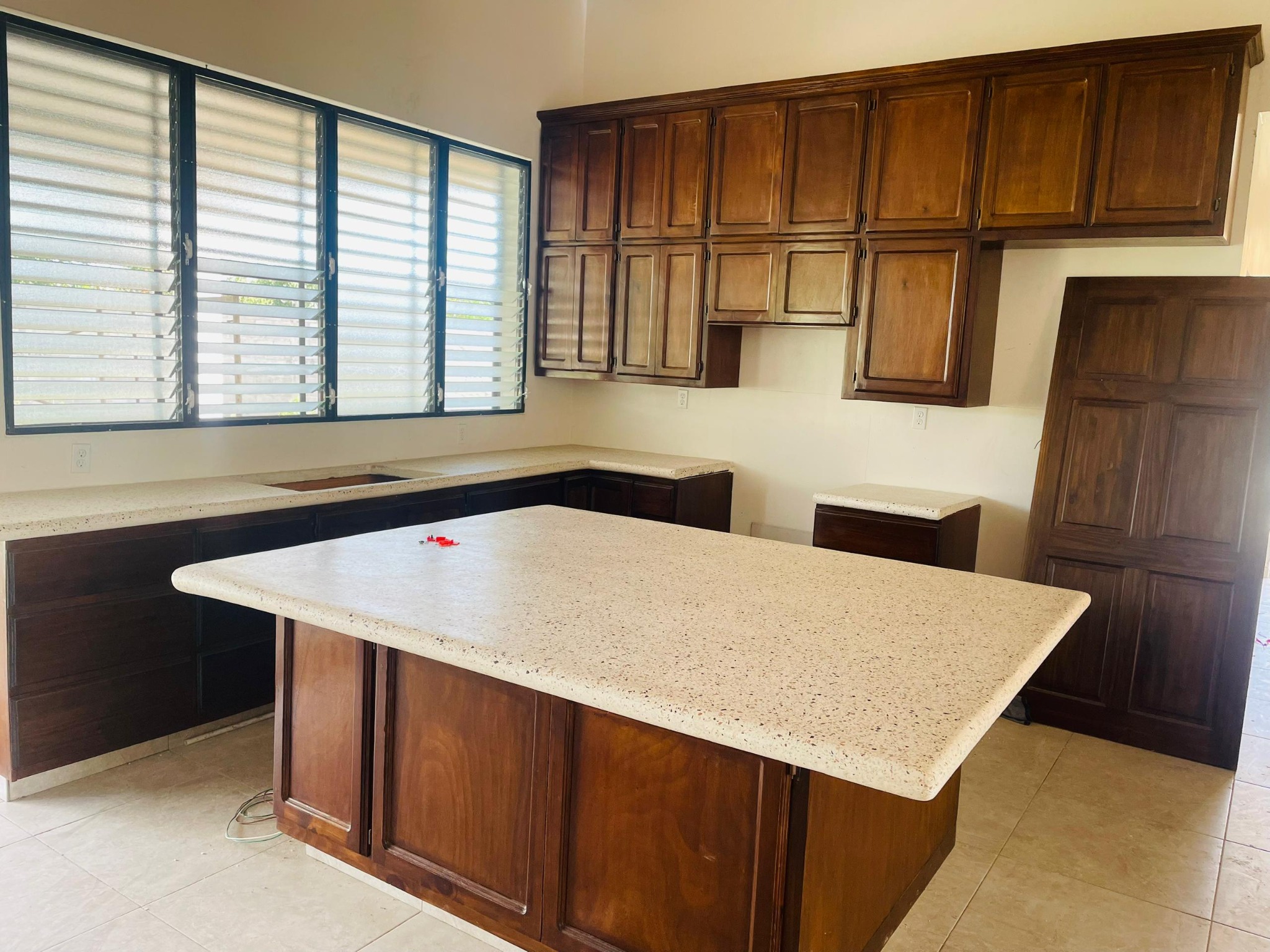 Custom cabinetry and exposed-aggregate concrete countertops in an MAF residence